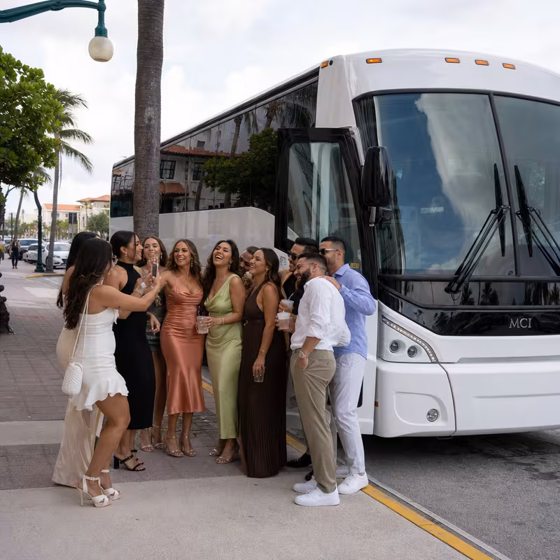 Passengers loading luggage while boarding an Delray Beach group shuttle