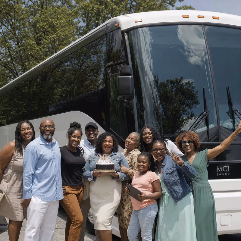 Passengers loading luggage while boarding an Delray Beach group shuttle