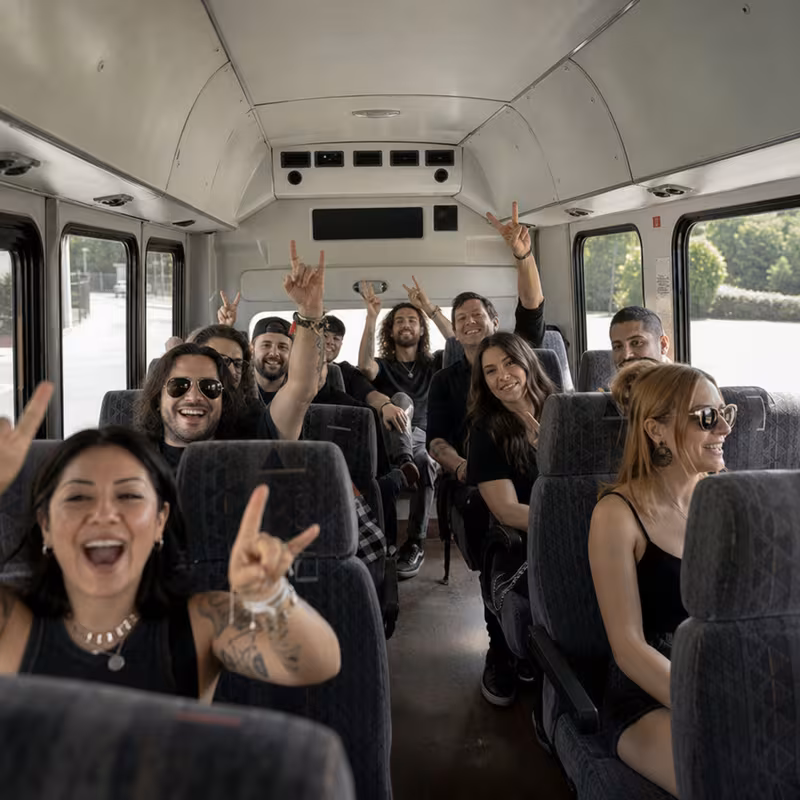 Party bus interior with wraparound leather seating and LED lighting in Delray Beach