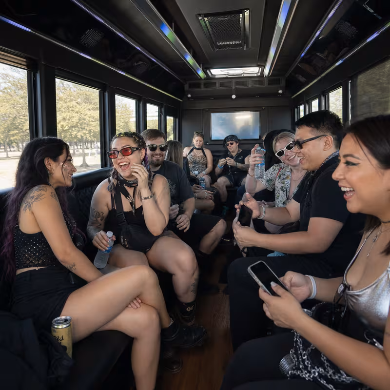 Passengers loading luggage while boarding an Delray Beach group shuttle