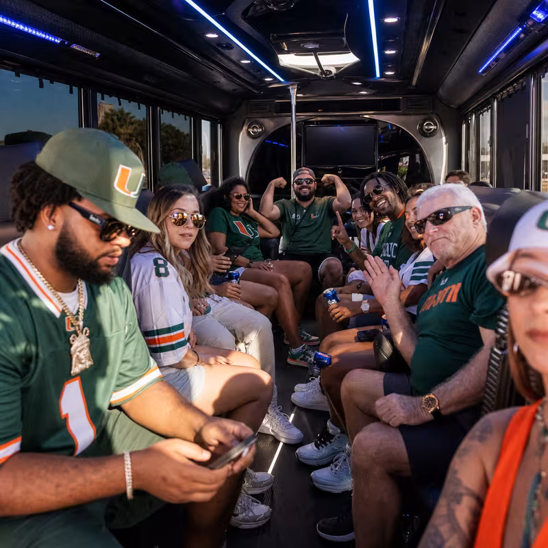 Group boarding a white charter bus for Sporting Event Transportation transportation in Delray Beach