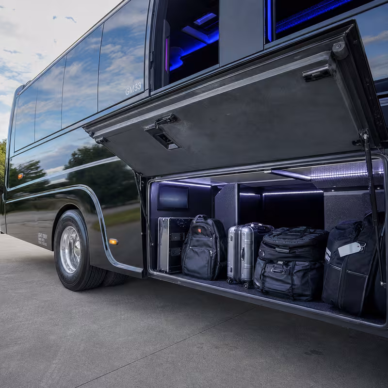 Party bus interior with wraparound leather seating and LED lighting in Delray Beach