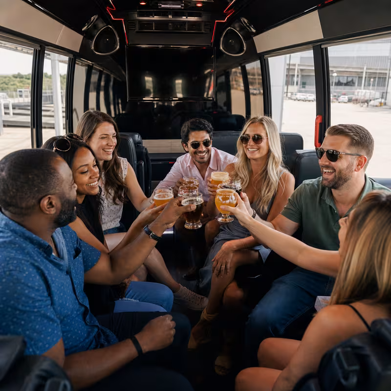 Group boarding a white charter bus for Winery & Brewery Tour Transportation transportation in Delray Beach